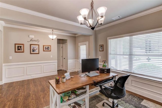 office with hardwood / wood-style flooring, crown molding, and a notable chandelier