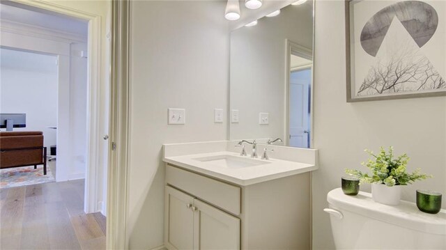 3173 Rockbridge Rd, Avondale Estates, GA 30002 - bathroom featuring wood finished floors, vanity, and toilet