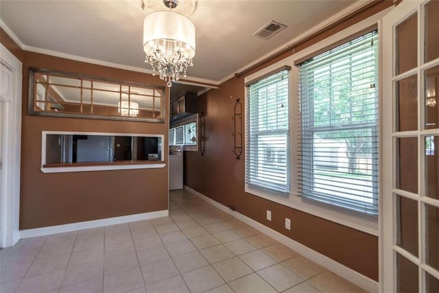 245 Alcovy St, Monroe, GA 30655 - tiled empty room with an inviting chandelier and ornamental molding