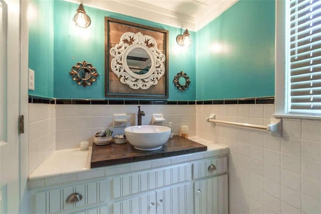 245 Alcovy St, Monroe, GA 30655 - bathroom featuring tile walls, vanity, and crown molding