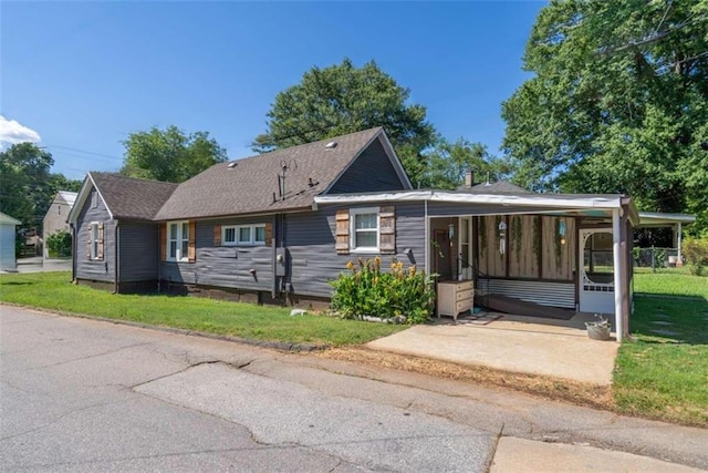 245 Alcovy St, Monroe, GA 30655 - view of front of home with a front lawn and a carport