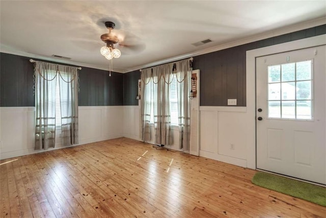245 Alcovy St, Monroe, GA 30655 - entrance foyer with ceiling fan, crown molding, and light wood-type flooring