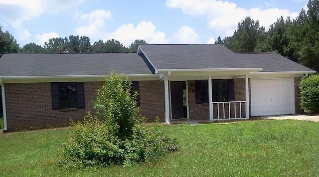 ranch-style house with a garage and a front yard