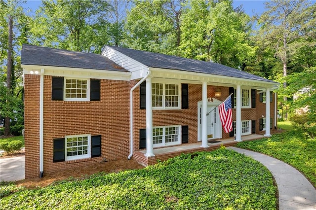 4331 E Kings Point Cir, Dunwoody, GA 30338 - view of front of house with brick siding and view of wooded area