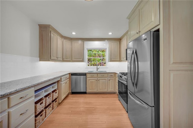 4331 E Kings Point Cir, Dunwoody, GA 30338 - kitchen featuring stainless steel appliances, a sink, light brown cabinets, light wood-type flooring, and light stone counters