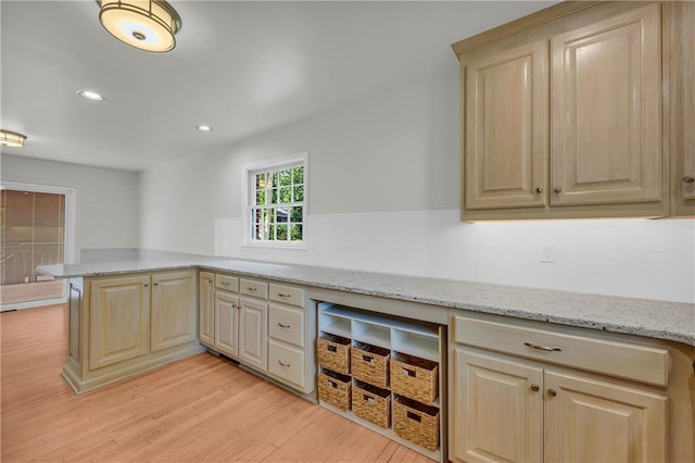 4331 E Kings Point Cir, Dunwoody, GA 30338 - kitchen with light wood-style floors, light brown cabinetry, a peninsula, light stone counters, and recessed lighting