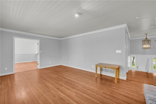 4331 E Kings Point Cir, Dunwoody, GA 30338 - unfurnished living room with wood finished floors, a chandelier, crown molding, and baseboards