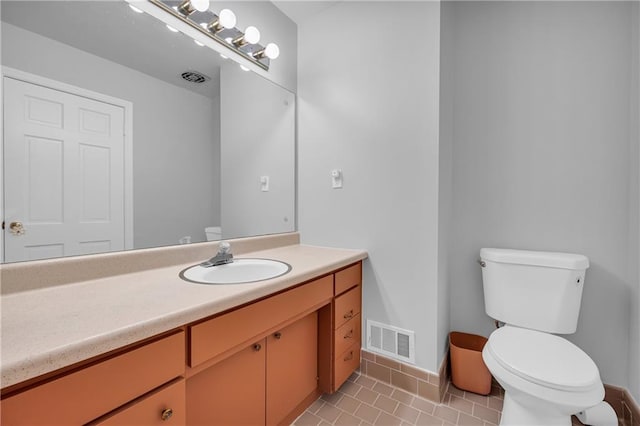 4331 E Kings Point Cir, Dunwoody, GA 30338 - half bath with toilet, baseboards, vanity, and tile patterned floors