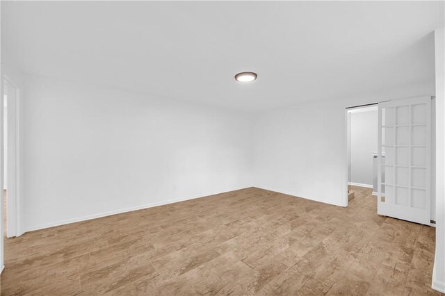 4331 E Kings Point Cir, Dunwoody, GA 30338 - unfurnished bedroom with light wood-type flooring and baseboards