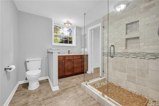 4331 E Kings Point Cir, Dunwoody, GA 30338 - bathroom with a stall shower, toilet, vanity, and baseboards