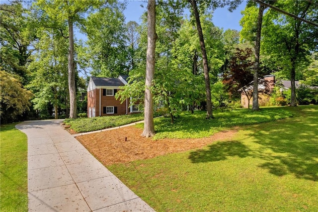 4331 E Kings Point Cir, Dunwoody, GA 30338 - view of front facade with a front yard, brick siding, and driveway
