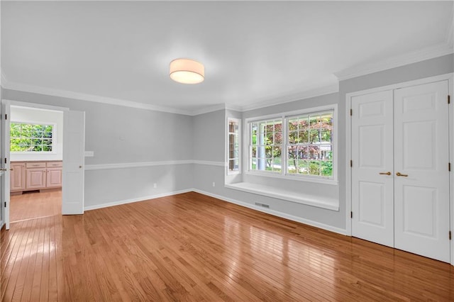 4331 E Kings Point Cir, Dunwoody, GA 30338 - unfurnished room featuring light wood-style flooring, ornamental molding, and baseboards