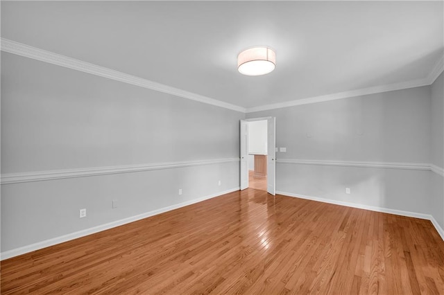 4331 E Kings Point Cir, Dunwoody, GA 30338 - spare room featuring baseboards, light wood-style flooring, and ornamental molding