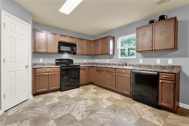 kitchen featuring sink and black appliances