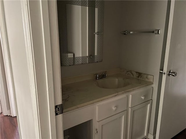 bathroom featuring wood-type flooring and vanity