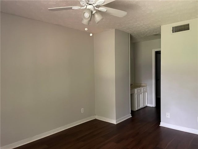 empty room with ceiling fan and hardwood / wood-style flooring