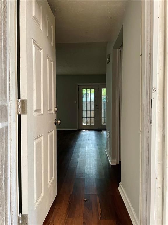 hall with dark hardwood / wood-style floors