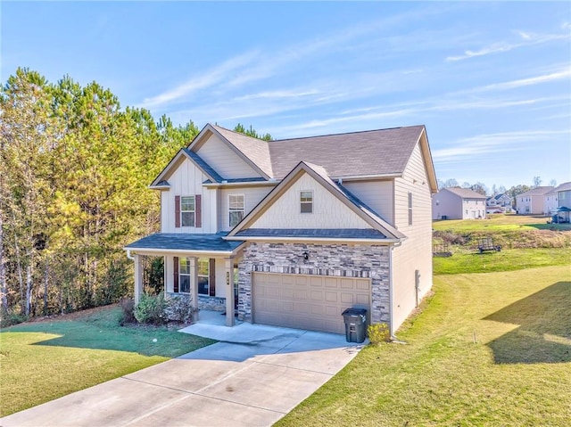 view of front of house featuring a garage and a front lawn