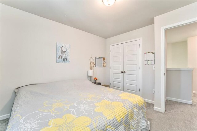 carpeted bedroom with a closet