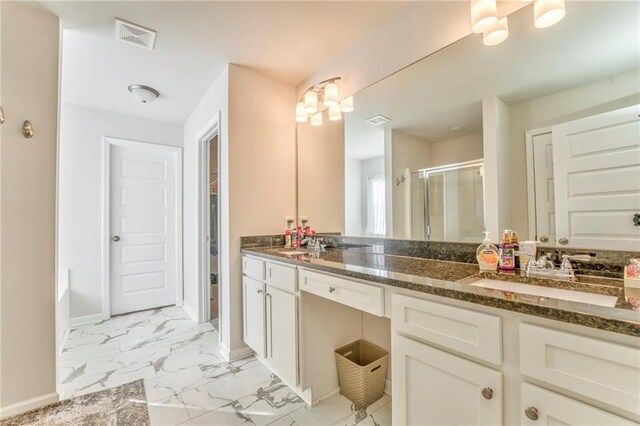 bathroom featuring vanity and independent shower and bath