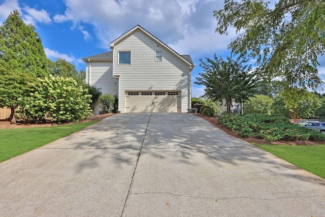 view of side of home featuring a garage