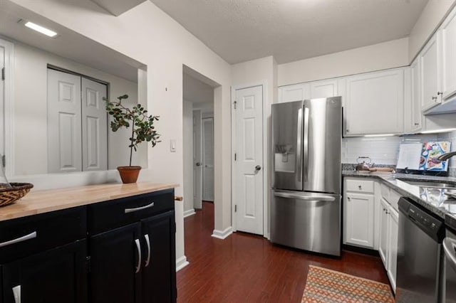 3701 Essex Ave Unit 2, Atlanta, GA 30339 - kitchen with stainless steel appliances, a sink, dark wood-style floors, and white cabinets