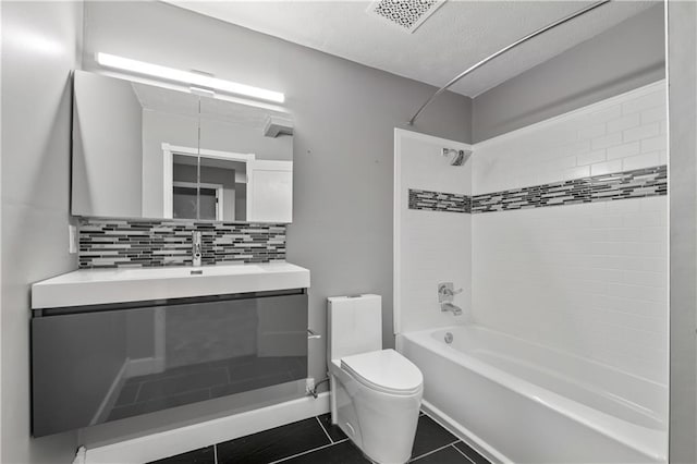2680 Pine Tree Rd NE Unit 2, Atlanta, GA 30324 - full bath with bathtub / shower combination, vanity, tile patterned flooring, tasteful backsplash, and a textured ceiling