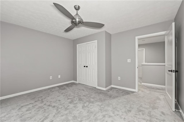 2680 Pine Tree Rd NE Unit 2, Atlanta, GA 30324 - unfurnished bedroom with a textured ceiling, carpet, a closet, and ceiling fan