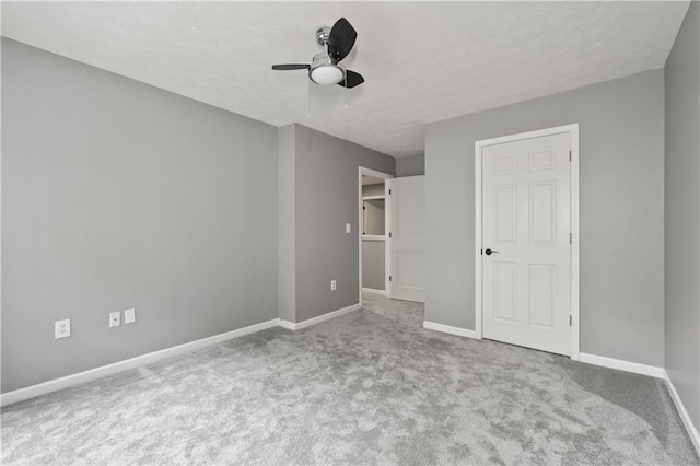 2680 Pine Tree Rd NE Unit 2, Atlanta, GA 30324 - unfurnished bedroom with carpet flooring, a textured ceiling, and a ceiling fan