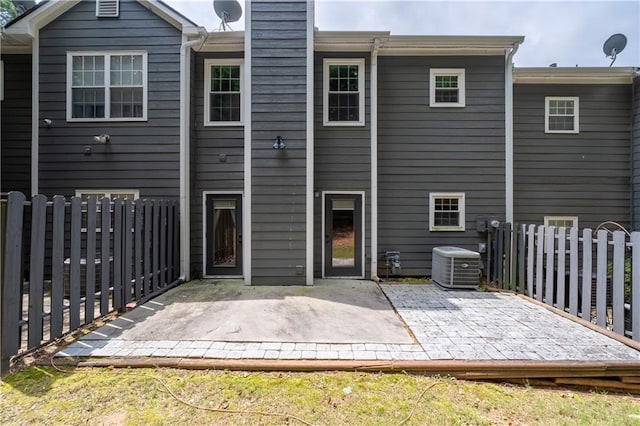 2680 Pine Tree Rd NE Unit 2, Atlanta, GA 30324 - rear view of house featuring a patio area and a chimney