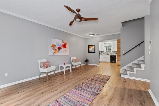2680 Pine Tree Rd NE Unit 2, Atlanta, GA 30324 - sitting room with ceiling fan, stairs, light wood finished floors, and crown molding