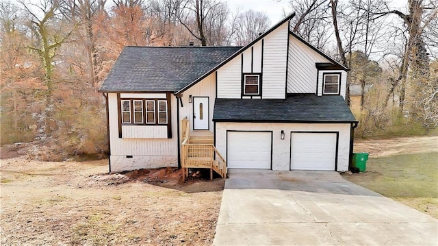 view of front of home featuring a garage, crawl space, a shingled roof, and driveway