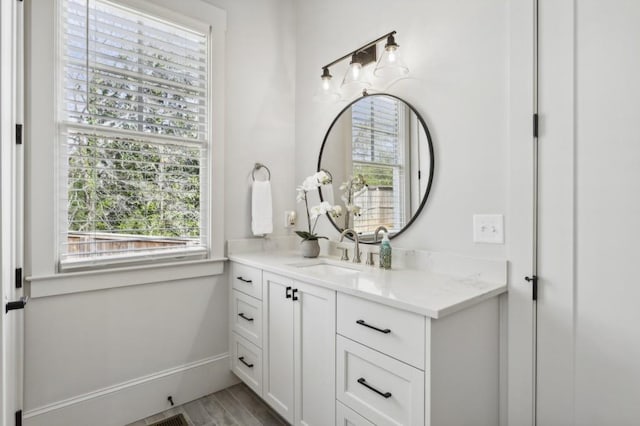 bathroom with vanity and hardwood / wood-style flooring