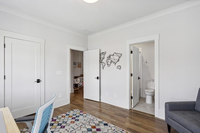 office space with crown molding and dark tile floors