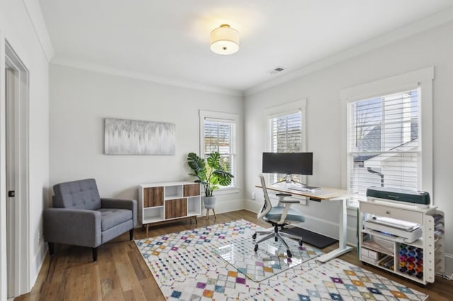 home office featuring ornamental molding, a healthy amount of sunlight, and dark wood-type flooring