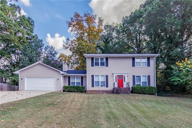 view of front of house with a garage and a front yard