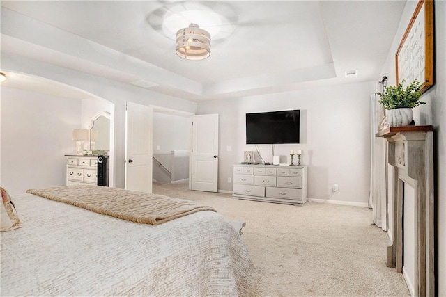 1329 Old Glory Ct, Hoschton, GA 30548 - unfurnished bedroom with a tray ceiling, carpet, and arched walkways