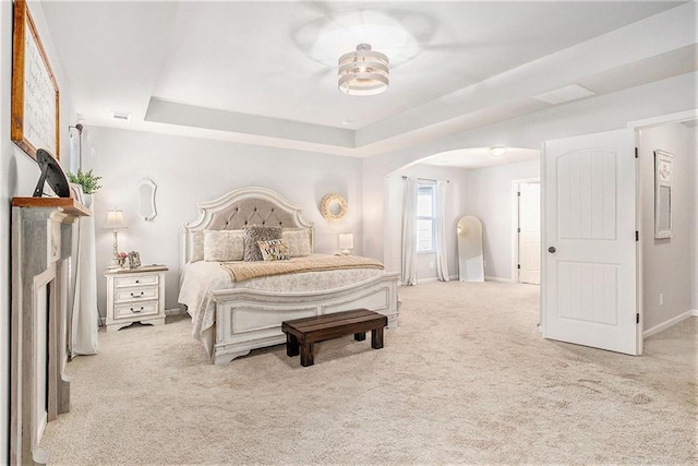 1329 Old Glory Ct, Hoschton, GA 30548 - carpeted bedroom featuring arched walkways and a raised ceiling
