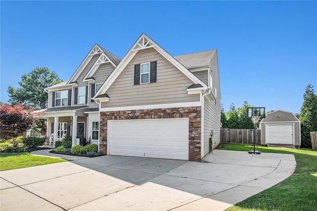 1329 Old Glory Ct, Hoschton, GA 30548 - craftsman-style home with driveway, stone siding, and an attached garage