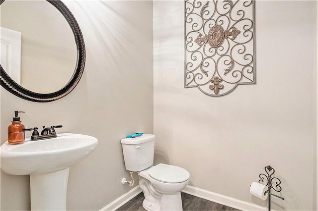 1329 Old Glory Ct, Hoschton, GA 30548 - bathroom featuring baseboards and wood finished floors