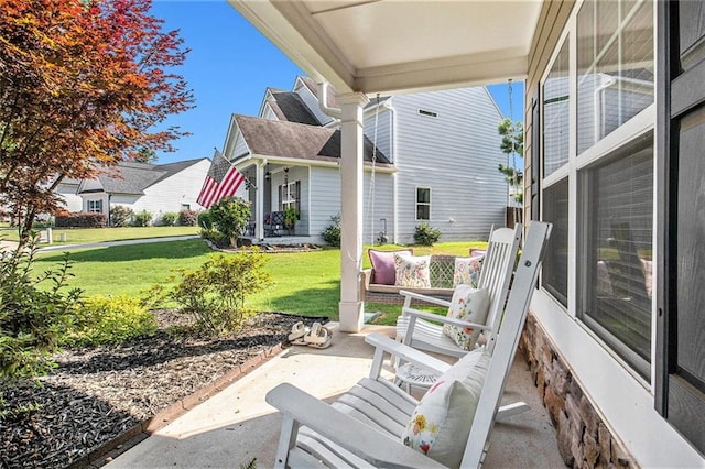 1329 Old Glory Ct, Hoschton, GA 30548 - covered porch featuring a lawn