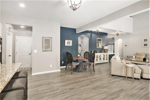 1329 Old Glory Ct, Hoschton, GA 30548 - living area with arched walkways, light wood-type flooring, and recessed lighting
