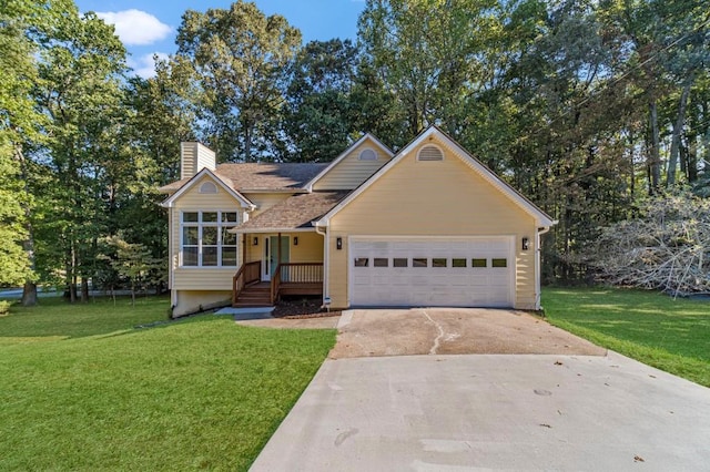 view of front of home with a garage and a front lawn