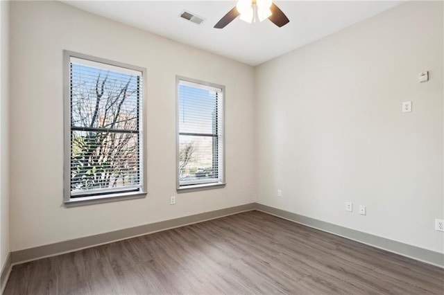 spare room with ceiling fan and hardwood / wood-style floors