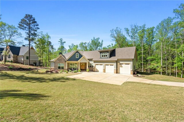 view of front of home featuring a front yard and a garage