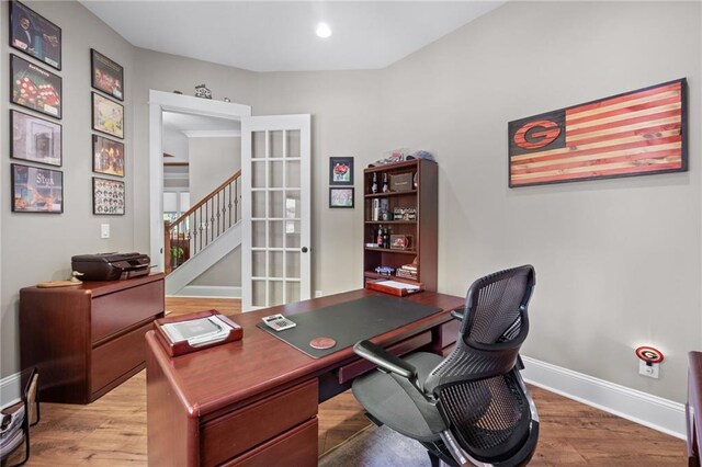 home office with hardwood / wood-style flooring