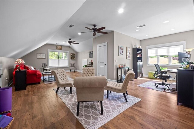 interior space featuring ceiling fan, lofted ceiling, and hardwood / wood-style floors