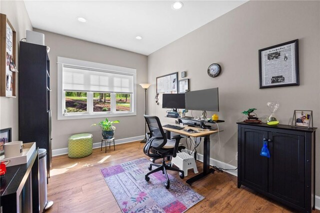 home office with wood-type flooring