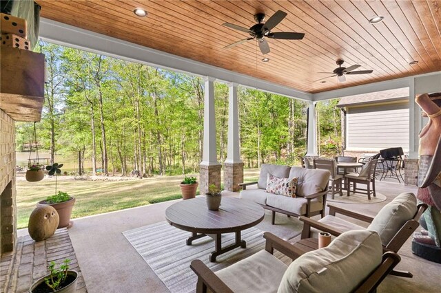 view of patio featuring an outdoor hangout area and ceiling fan