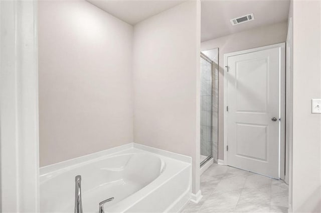 bathroom featuring plus walk in shower